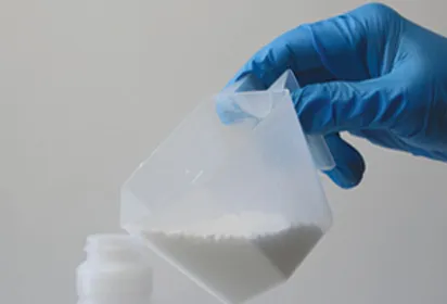 An image showing Cimexa being poured into a bottle for mixing